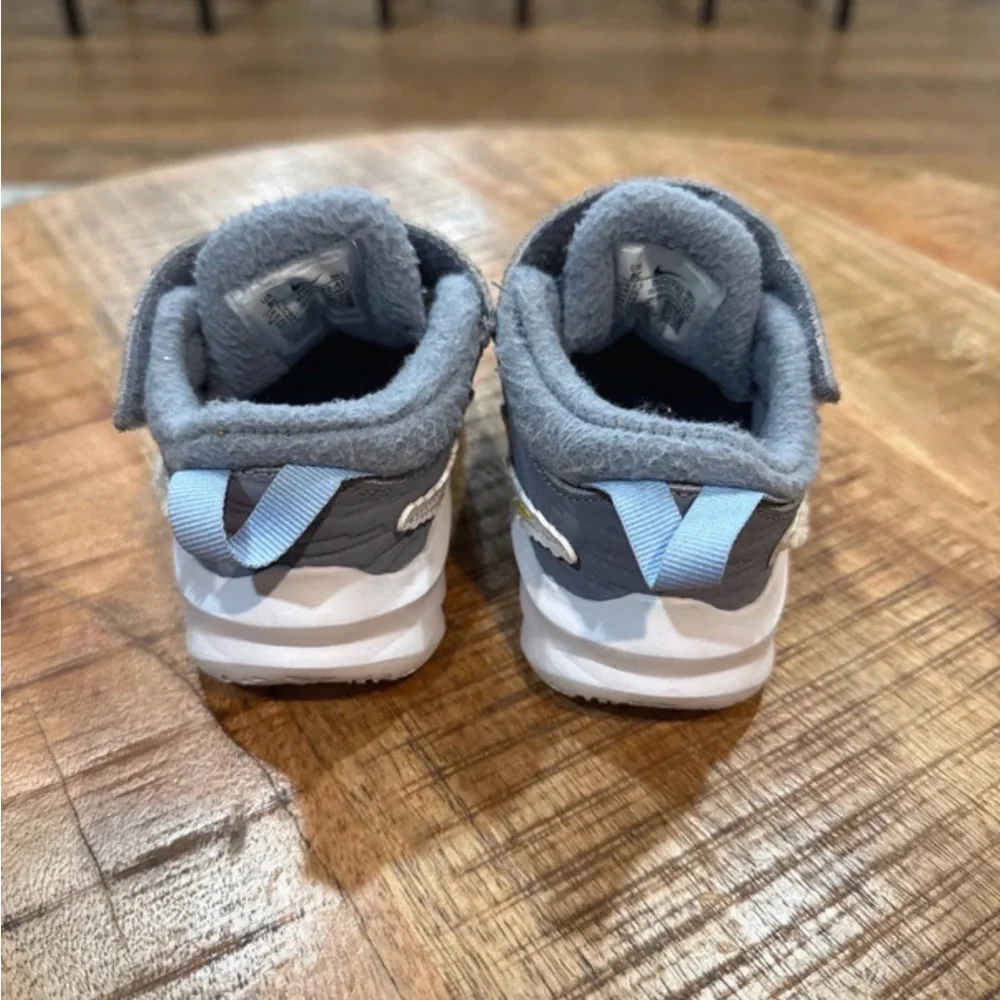 Kids Gray Nikes with lightning bolt